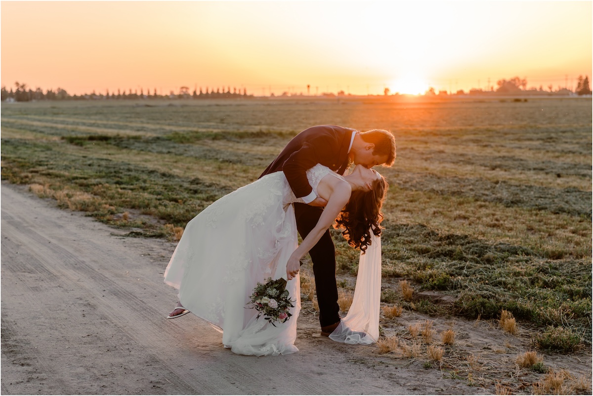 Groom dipping his bride with a romantic kiss in Denair, CA