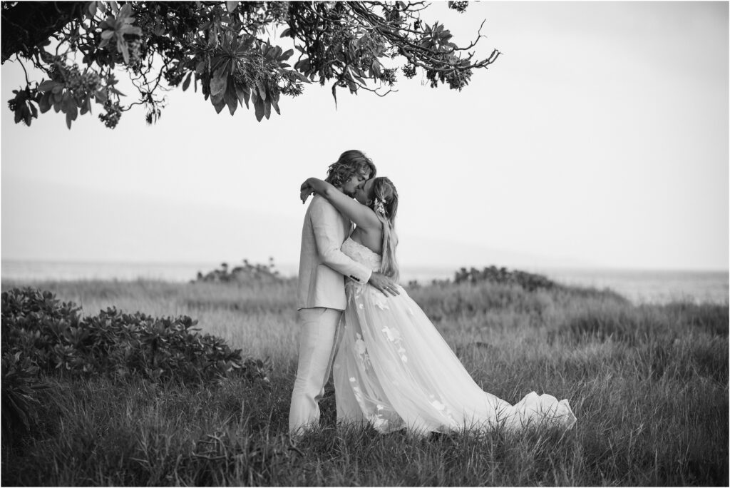 Bride and groom under a tree at Old Kona Airport beach