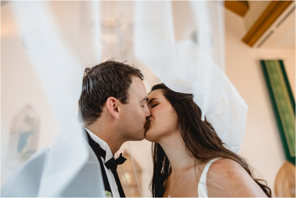 St. Michael the Archangel Church Kona Hawaii bride and groom kissing
